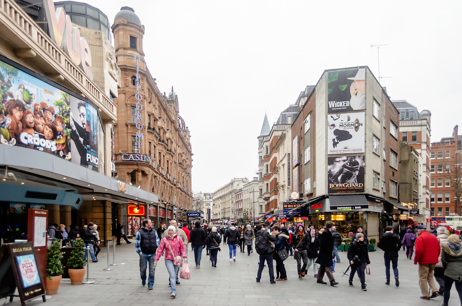 People walking through Leicester Square in London’s theater district