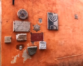 stone signs on orange wall