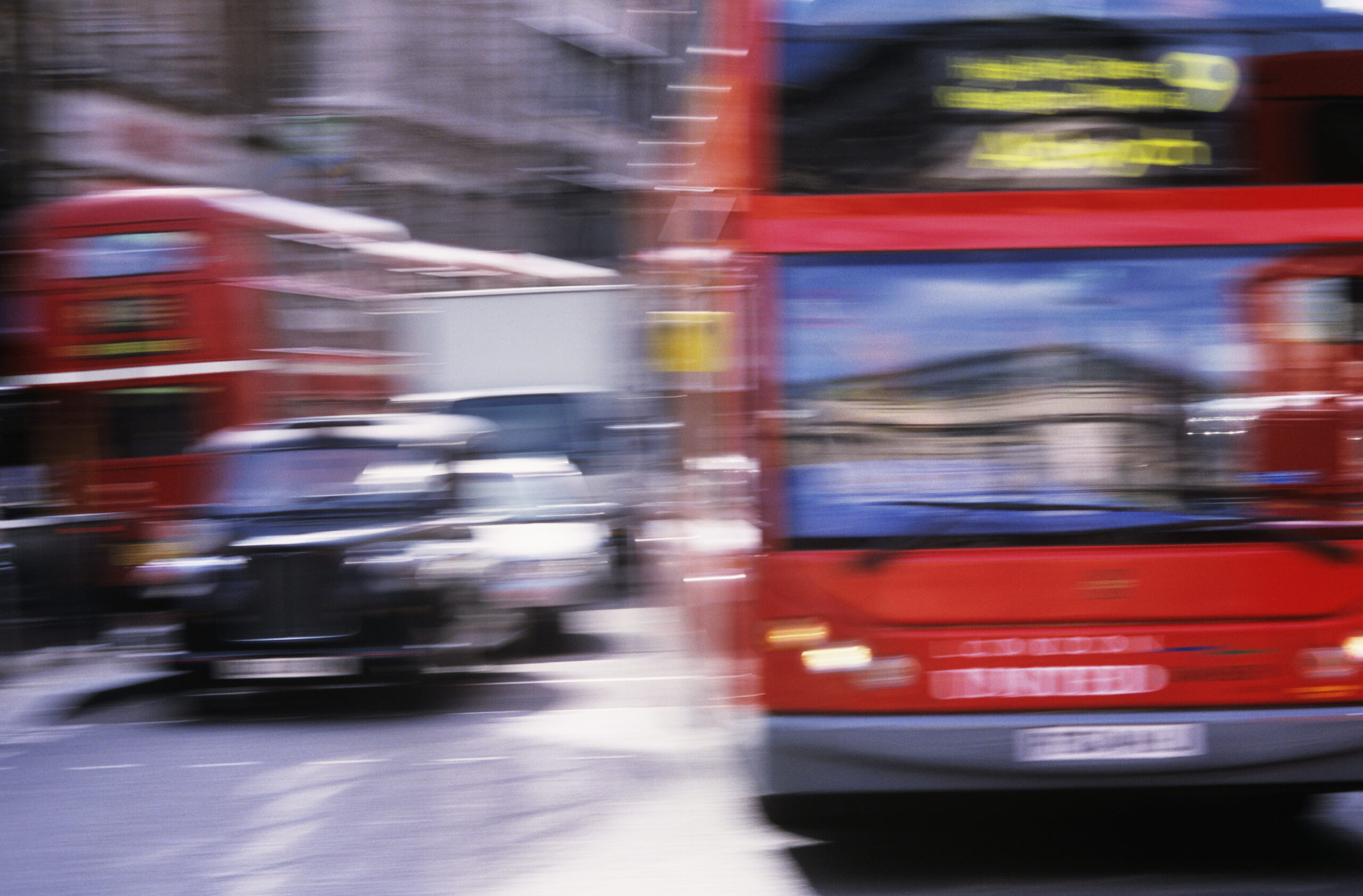 Black cab and red bus illustrating how to get around London