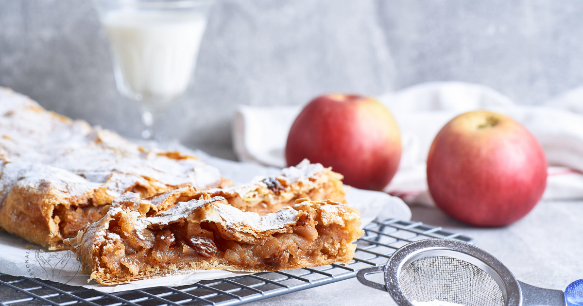 Traditional Austrian apple strudel served with red apples